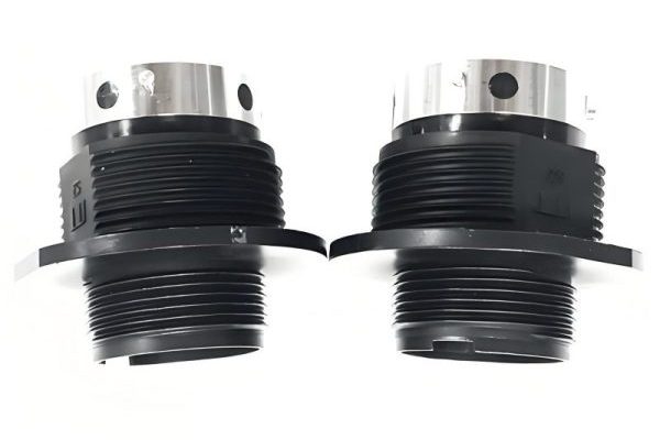 Insert molding process showing metal inserts in plastic parts